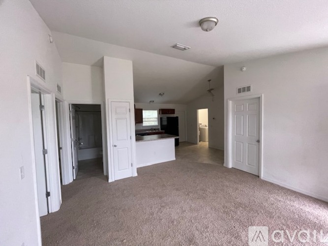 A living room with a couch and a television.