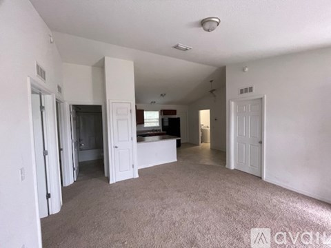 A living room with a couch and a television.