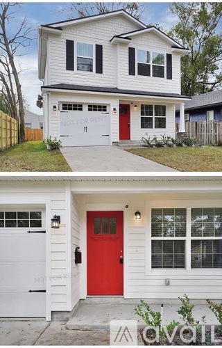 A two-story house with a red door and a sign that says "NOT FOR RENT".