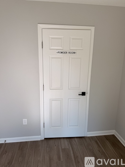 A white door with a sign that says "power room" on it.
