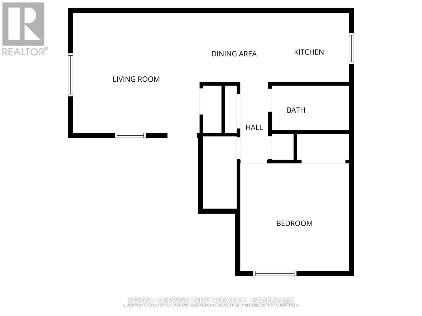 A floor plan of a house with a living room, dining area, kitchen, bath, hall, and bedroom.