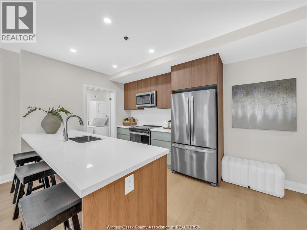 A kitchen with a white counter top and wooden cabinets.