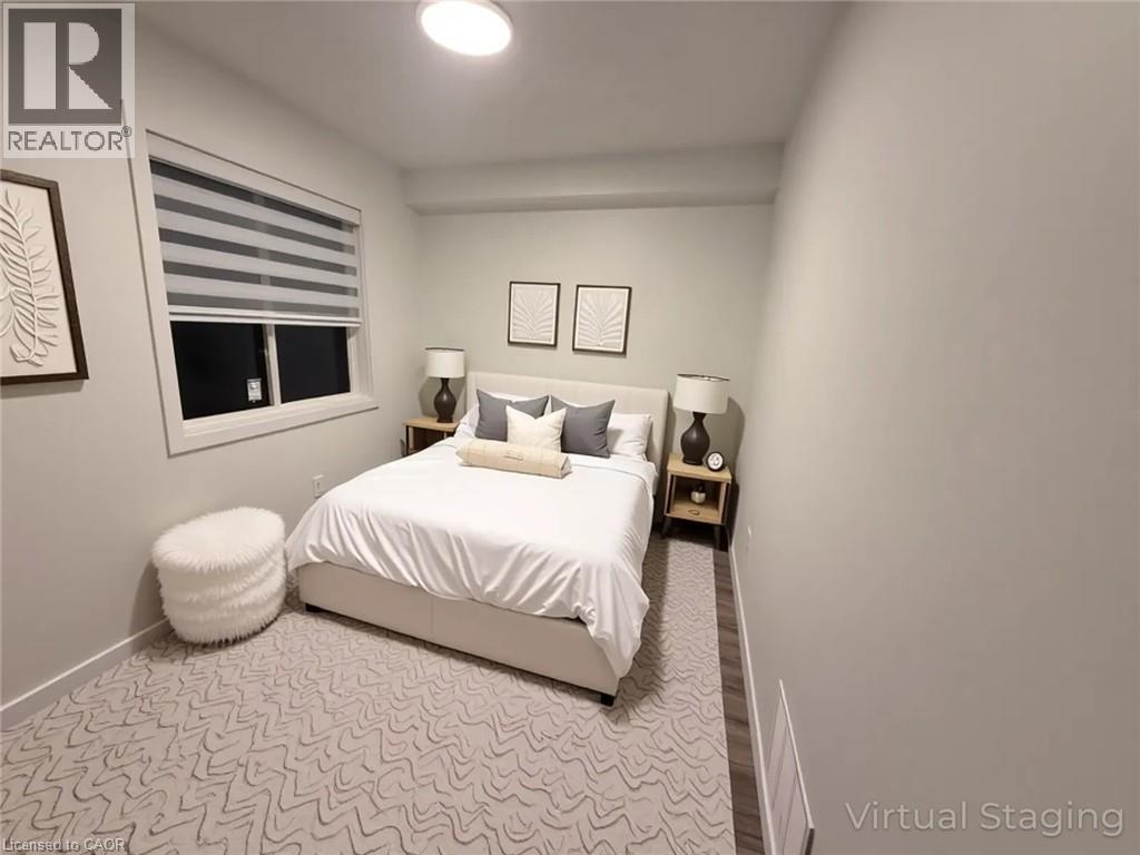 A bedroom with a bed, two lamps, and a window.