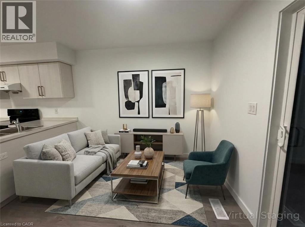 A living room with a couch, chair, and coffee table.