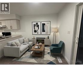 A living room with a couch, chair, and coffee table.
