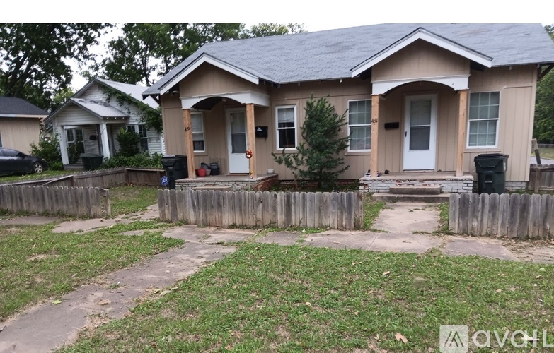 A house with a white door and a small porch.