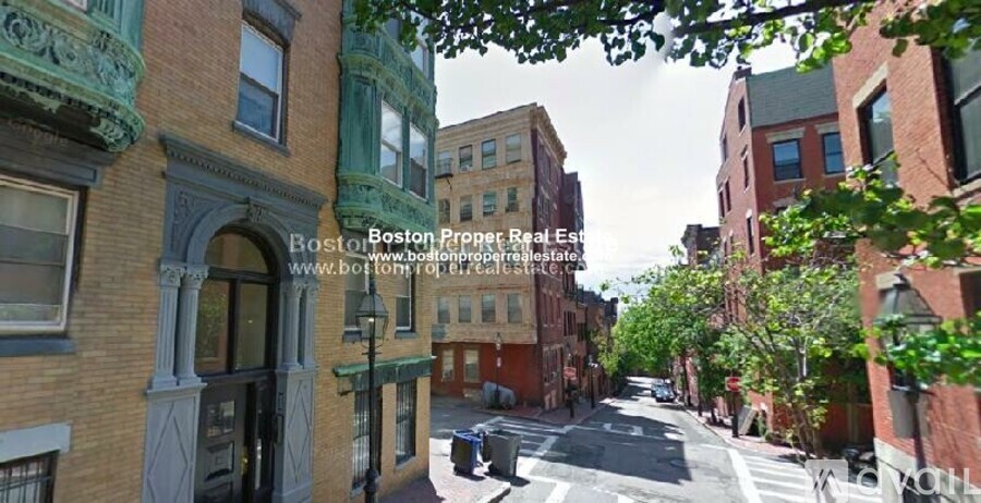 A street view of Boston with buildings on either side.