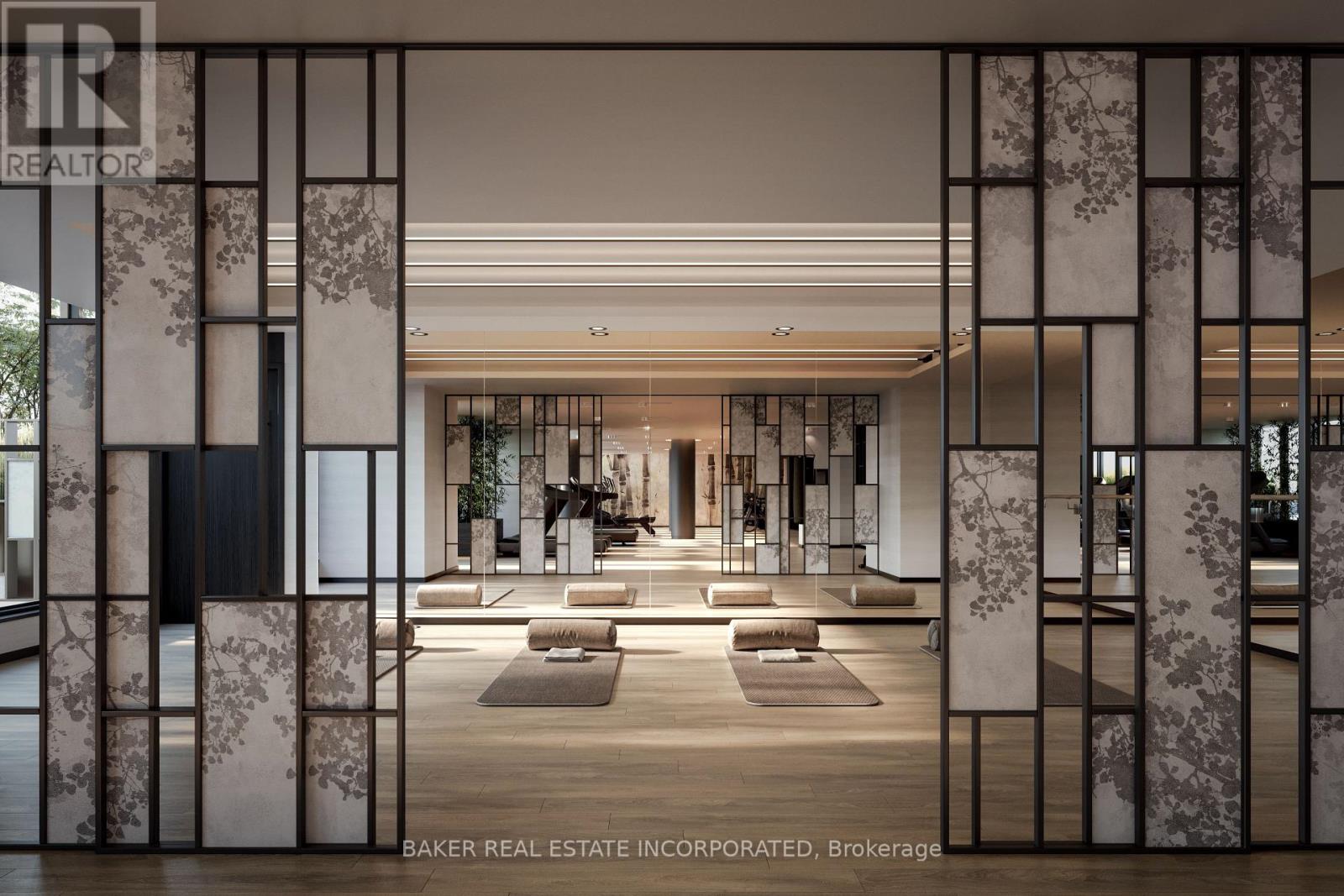 A modern interior space with a glass partition and a carpeted floor.