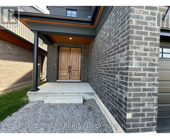 A house with a wooden door and a brick wall.