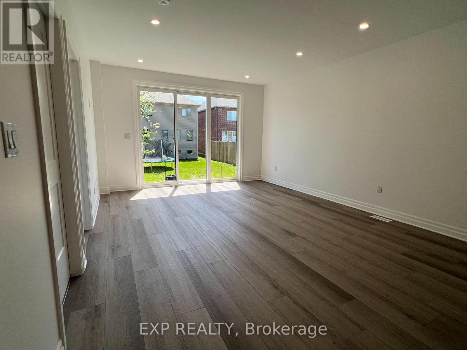 A room with EXP REALTY, Brokerage watermark on the floor.