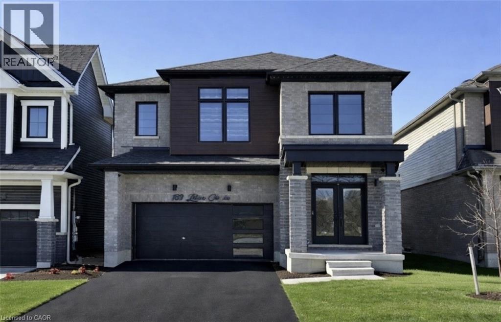 A modern two-story house with a garage and a driveway.