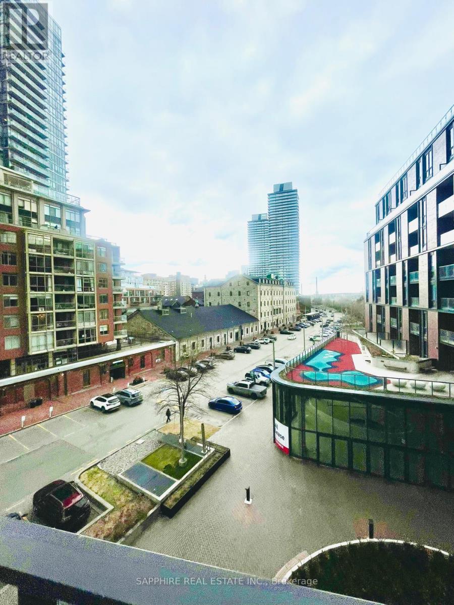 A city street with cars and buildings.