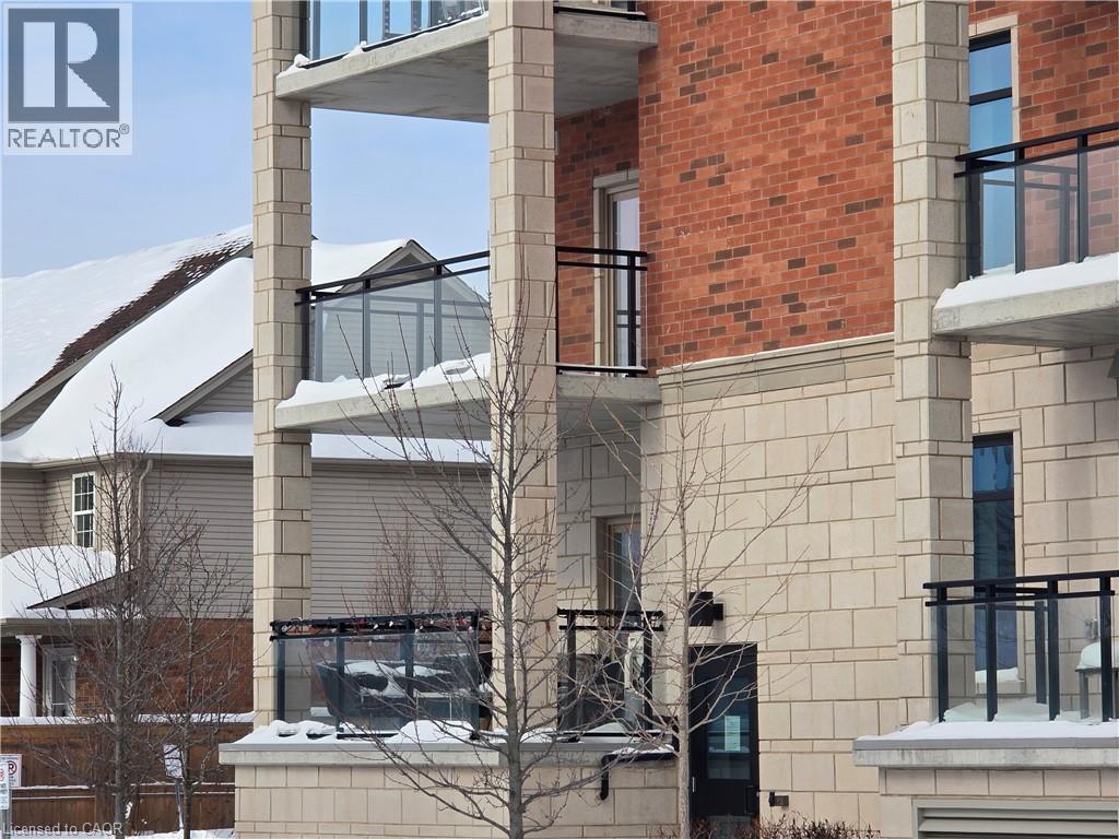 A building with a balcony covered in snow.