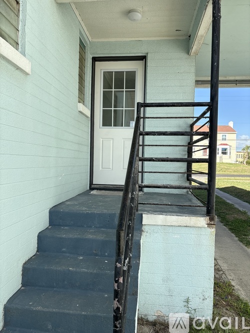 A set of stairs leading to a white door.
