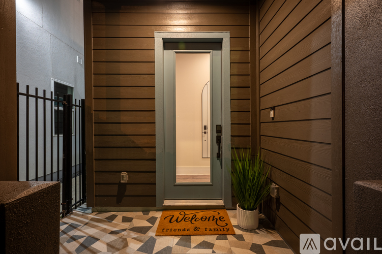 A home entrance with a mat that says Welcome.