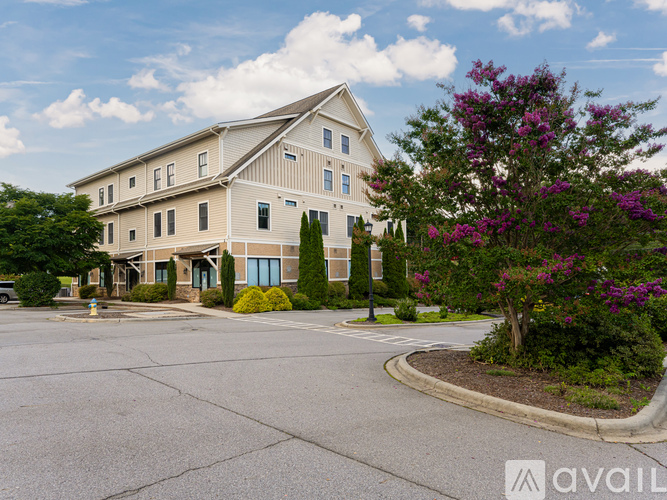 A large building with a parking lot in front of it.