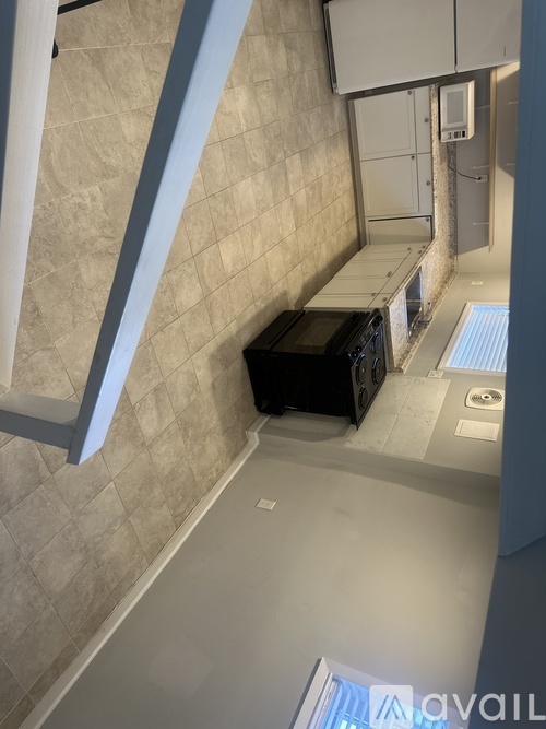 A bathroom with a toilet, sink, and a window.