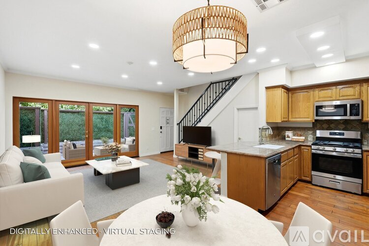 A modern kitchen with wooden cabinets and stainless steel appliances.