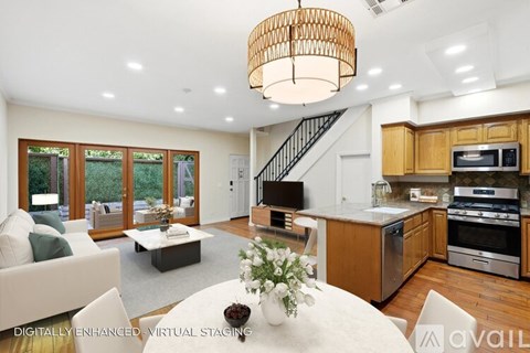 A modern kitchen with wooden cabinets and stainless steel appliances.