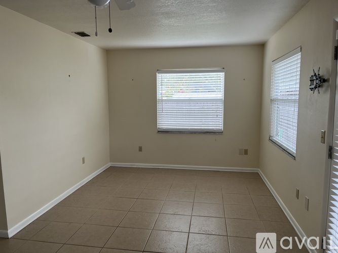 A room with a window and a door.