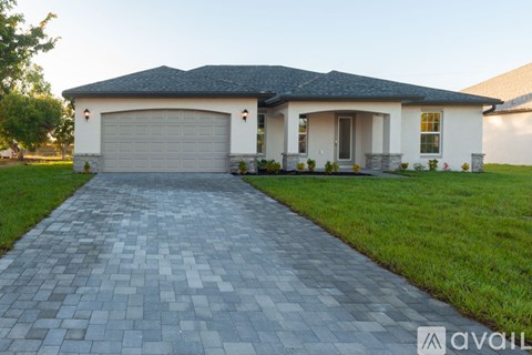 A house with a driveway in front of it.