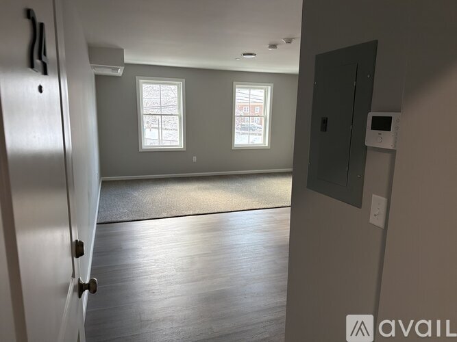 A room with a door and a window.