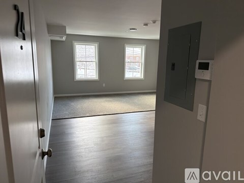 A room with a door and a window.