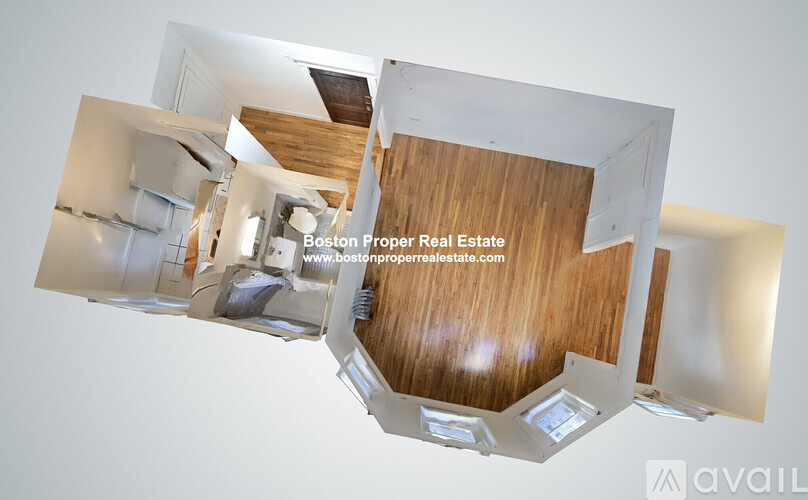 A modern interior space with wooden floors and white walls.
