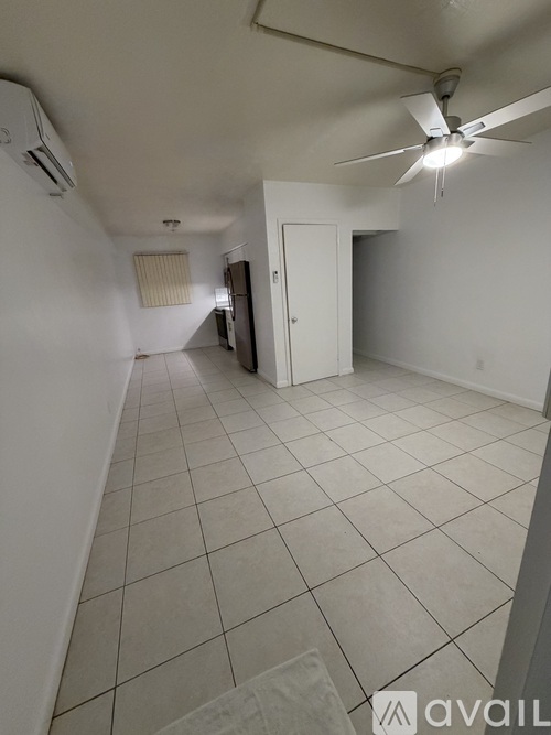 A room with white walls and a tiled floor.
