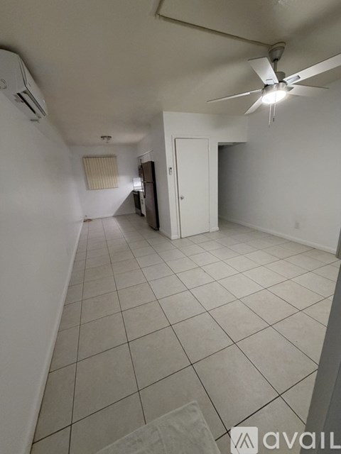 A room with white walls and a tiled floor.