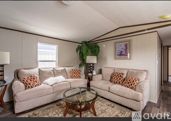 A living room with two couches and a coffee table.