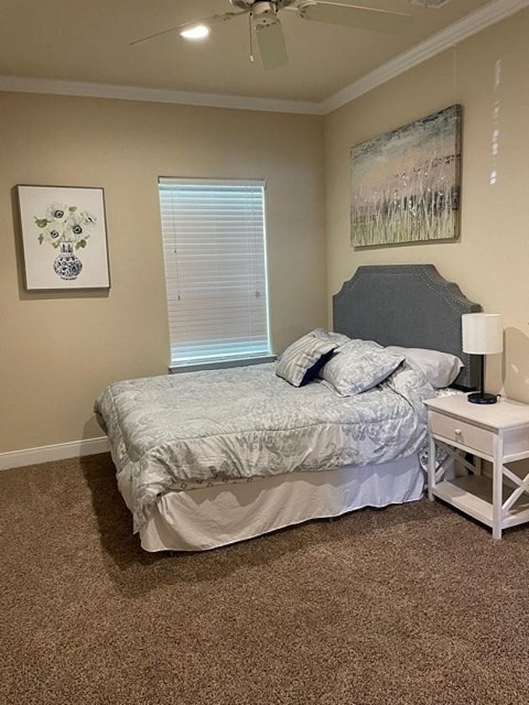A bedroom with a bed, nightstand, and two pictures on the wall.