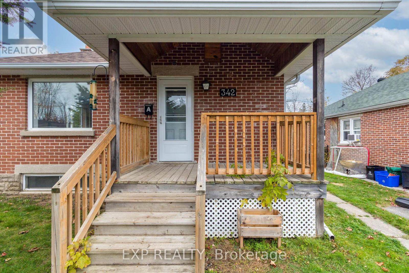 A house with a porch and a door numbered 342.