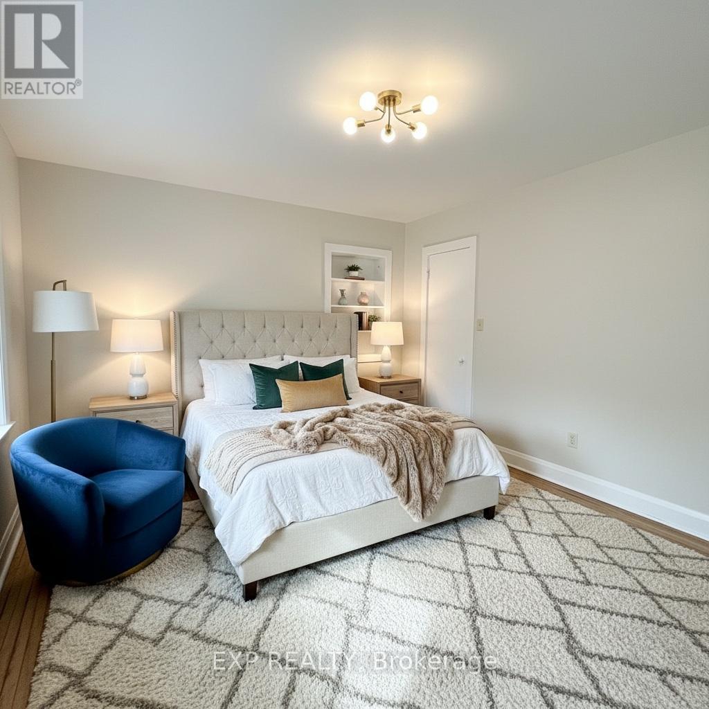 A bedroom with a large bed and a blue chair.