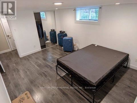 A room with a bed frame in it.