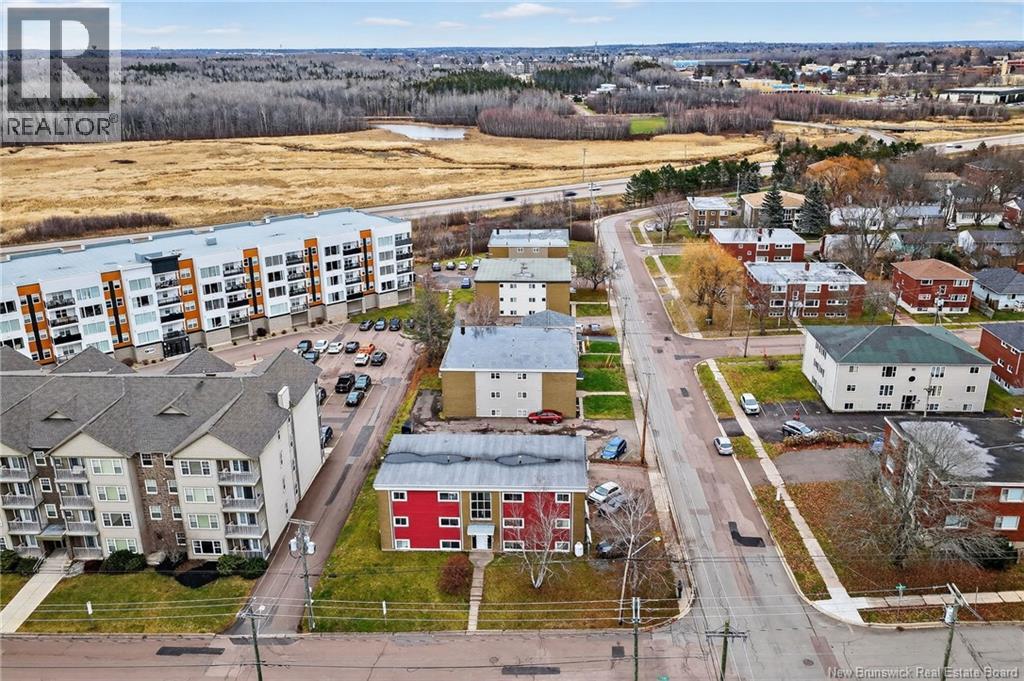 A bird's eye view of a residential area with houses and apartment buildings.