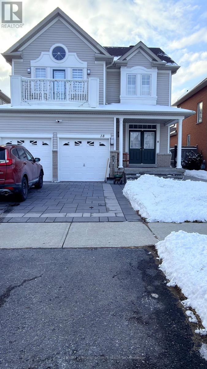 A house with a red car parked in front.