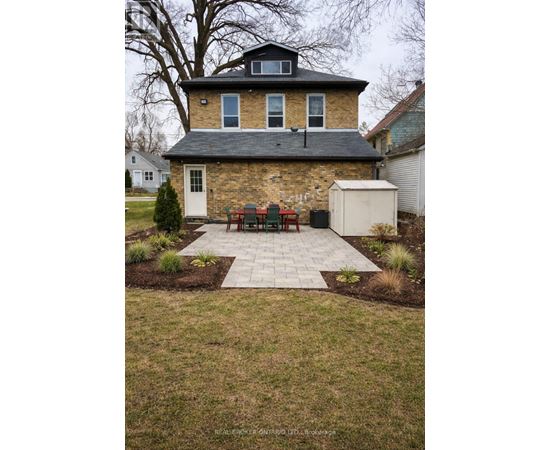 A house with a brick exterior and a white door.