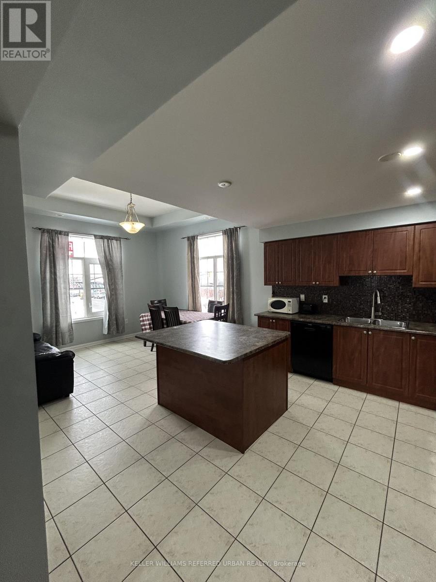 A kitchen with a large island in the middle of the room.