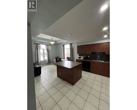 A kitchen with a large island in the middle of the room.