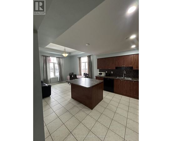 A kitchen with a large island in the middle of the room.
