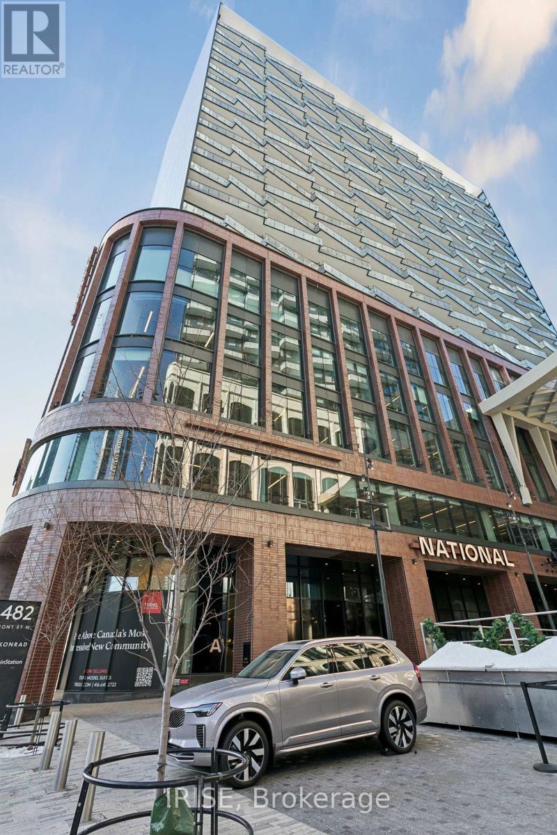 A modern building with a glass facade and a sign that reads "NATIONAL".