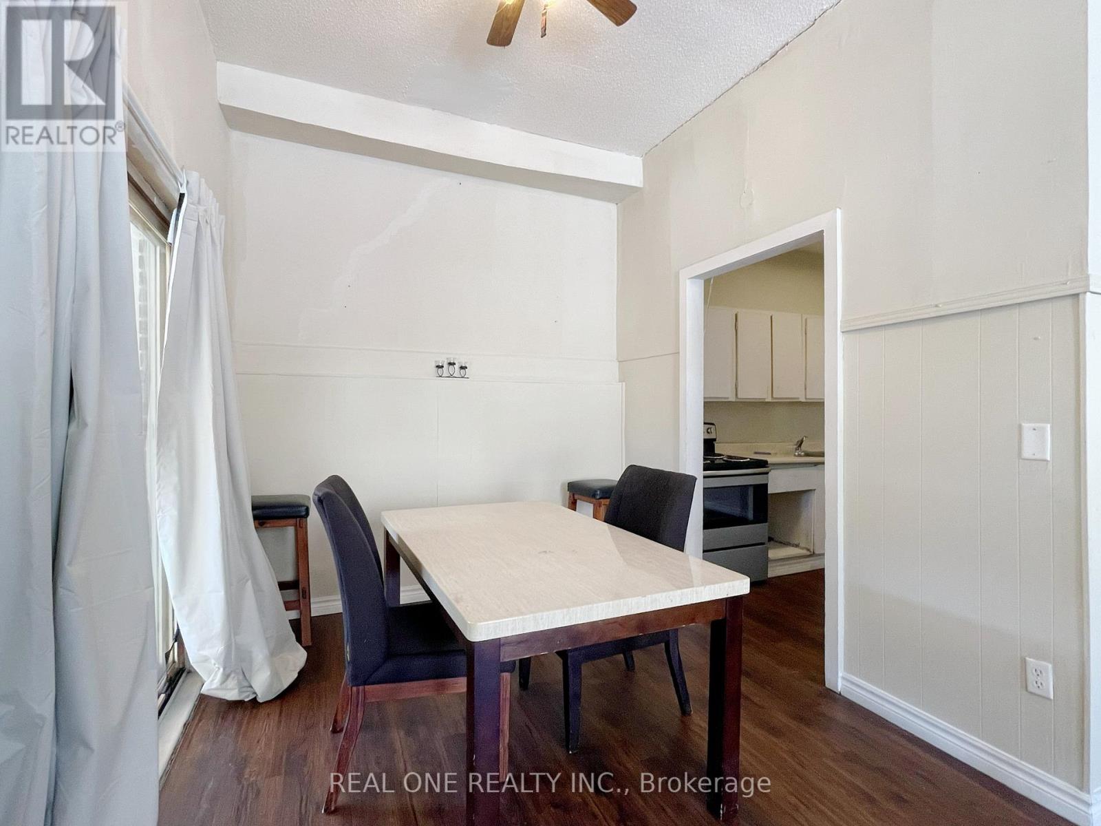 A dining room with a table and chairs is shown.