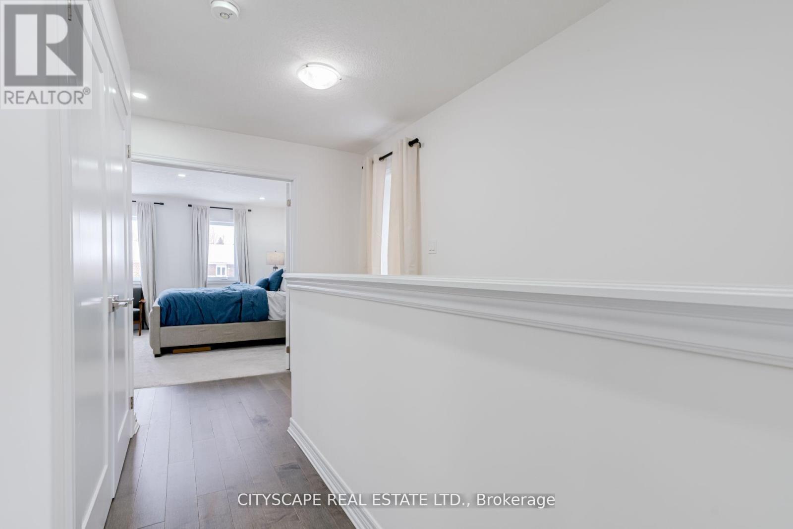 A bedroom with a bed and a window.