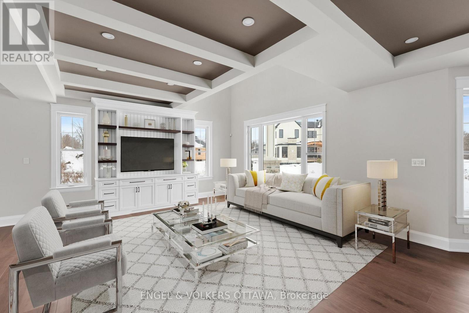 A modern living room with a glass coffee table and a white sofa.