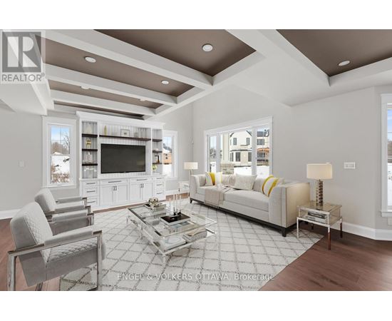 A modern living room with a glass coffee table and a white sofa.