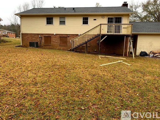 A house with a porch and a garage door.