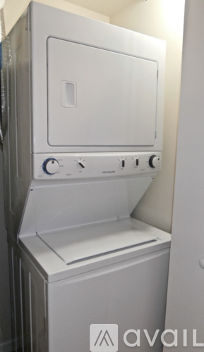 A white oven with a door and a handle on the right side.