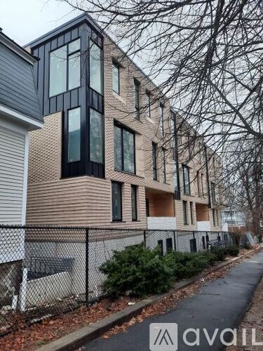 A modern building with a fence in front of it.