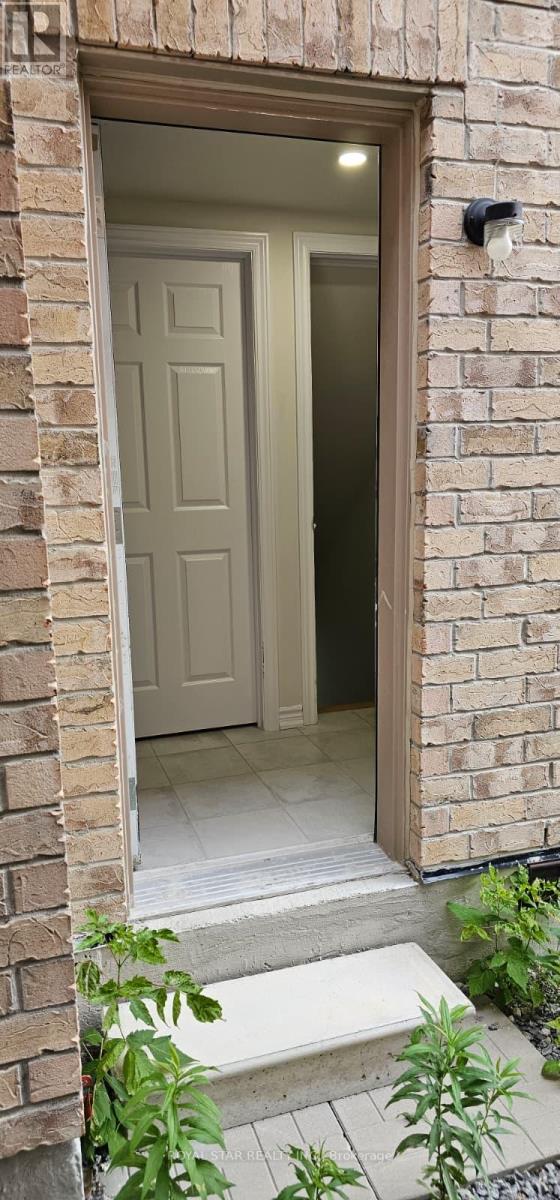A white door is open to a hallway.